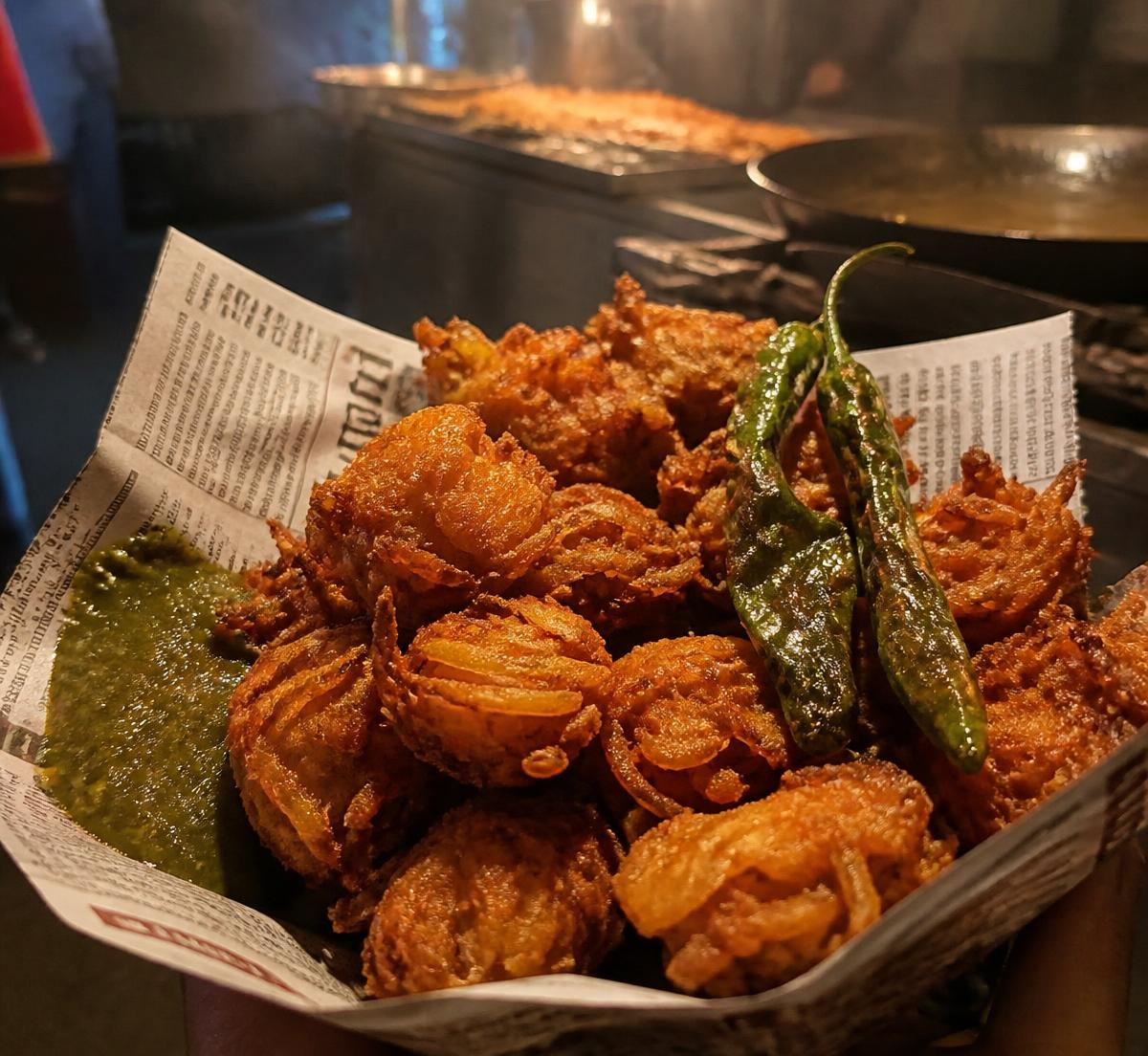 Crispy bhajiya in a newspaper cone